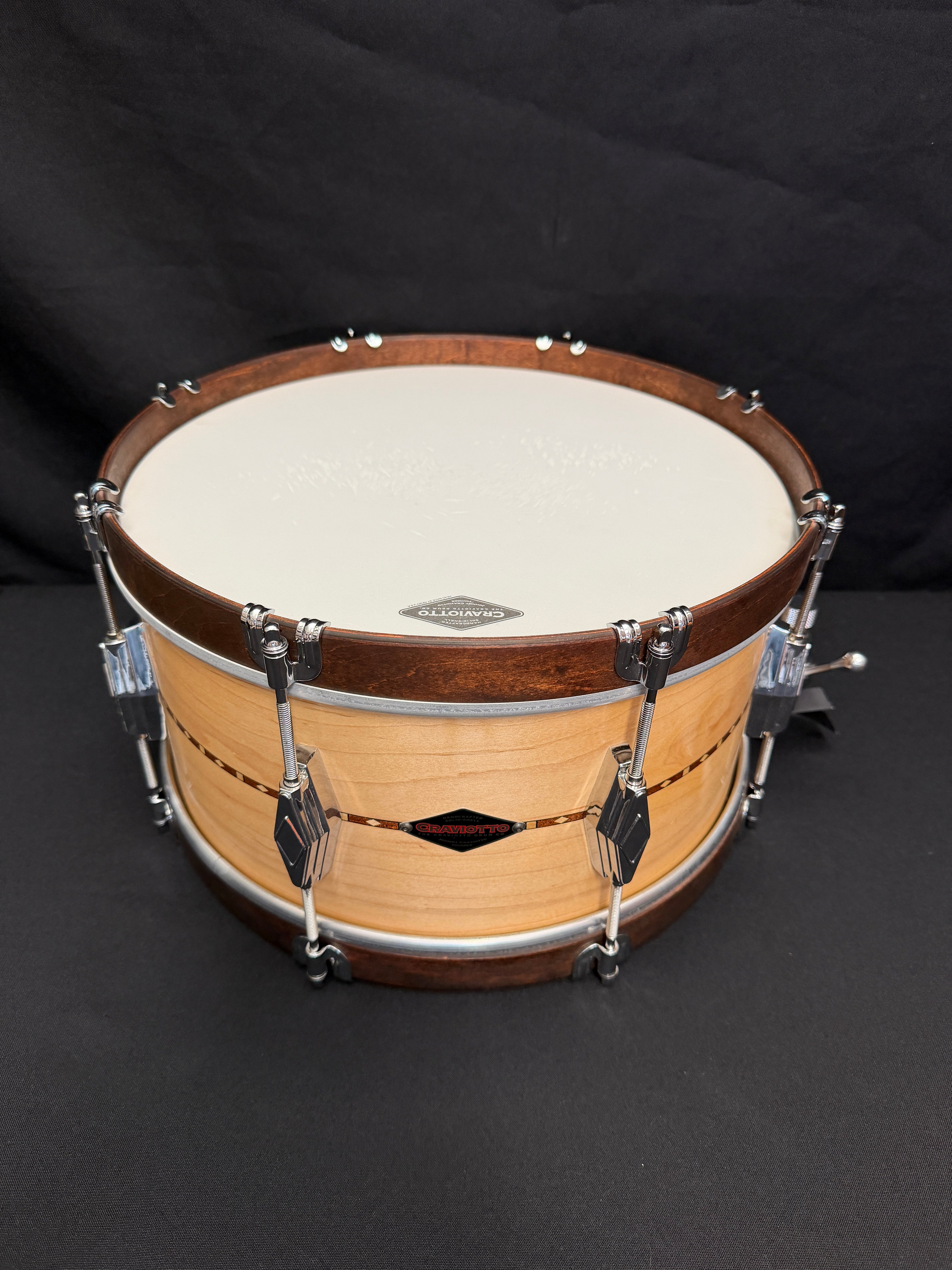 Wooden drum with a black background
