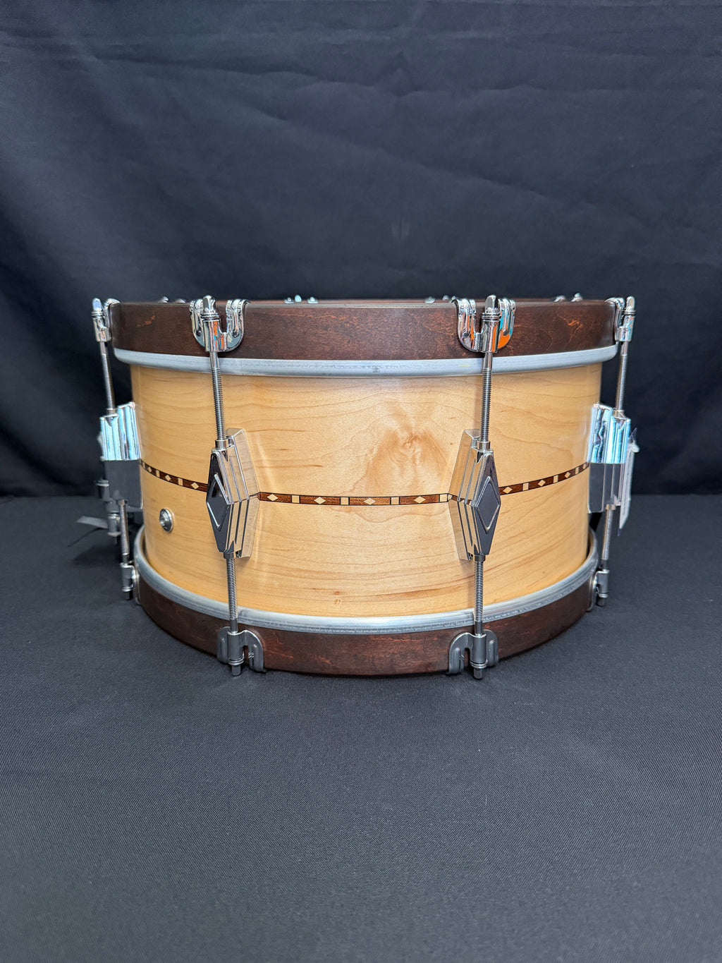 Wooden snare drum on a dark background