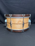 Wooden snare drum on a dark background