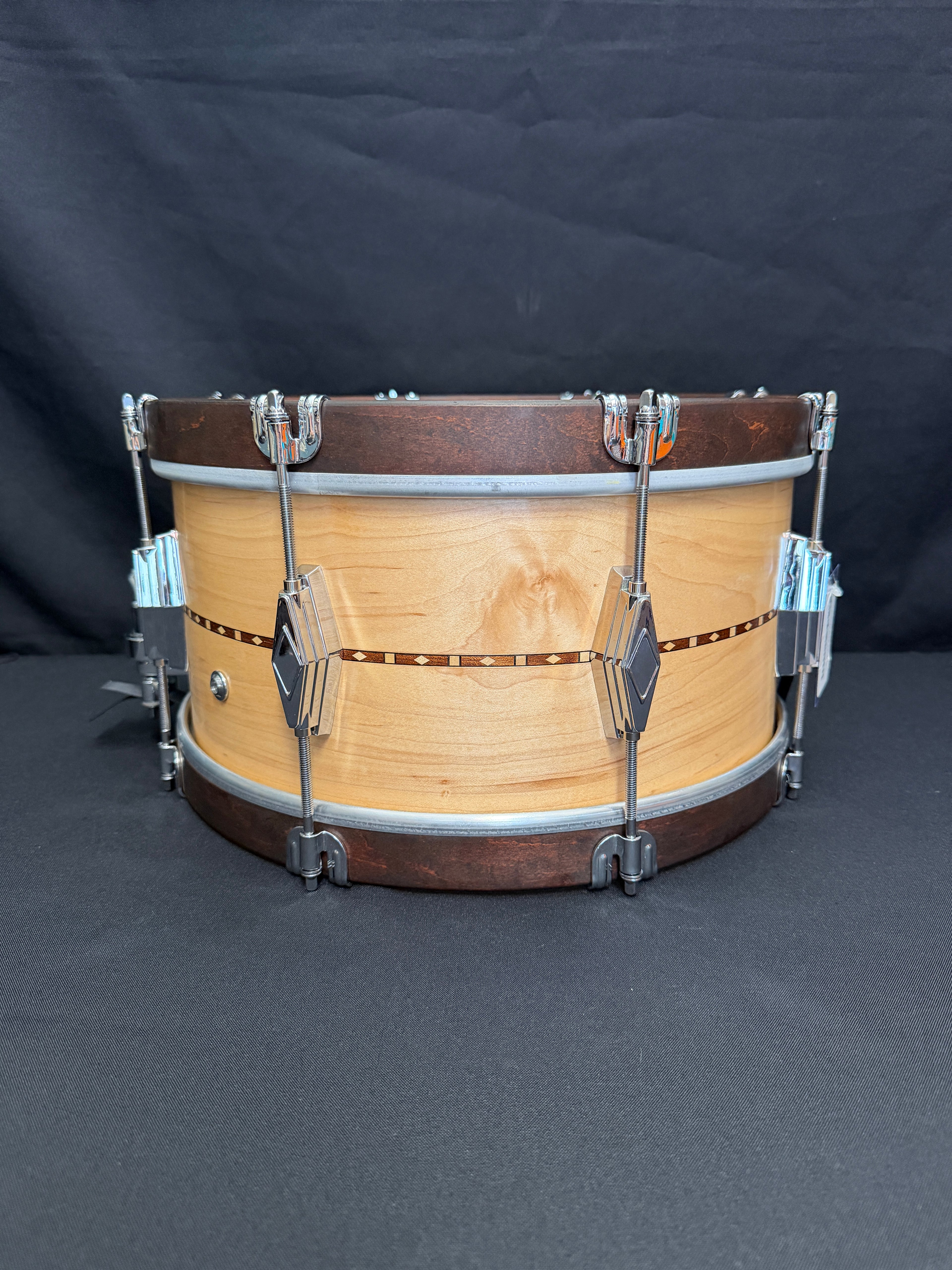Wooden snare drum on a dark background